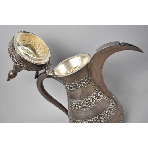 29 - A North African White Metal Coffee Pot with Engraved Banded Decoration to Body, 27.5cms High