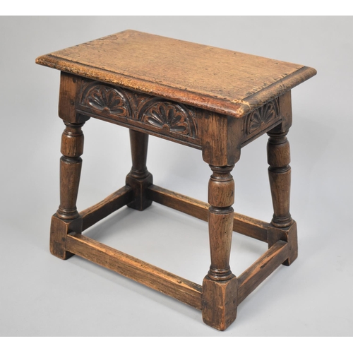 38 - A Carved Oak Peg Jointed Stool, Some Condition issues to Corner, 46cms Wide