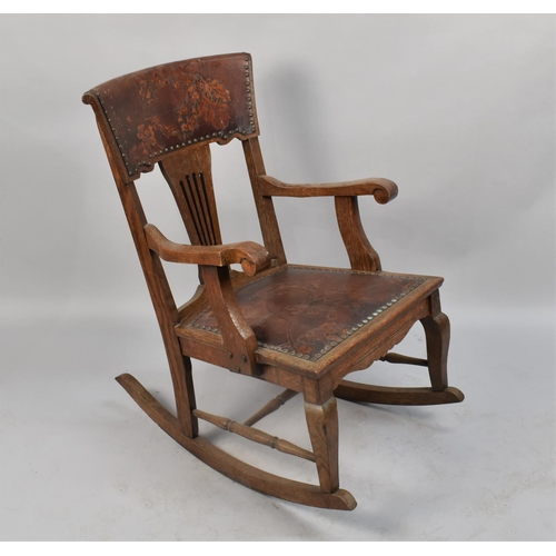 468 - An Edwardian Tooled Leather Upholstered Oak Framed Rocking Chair