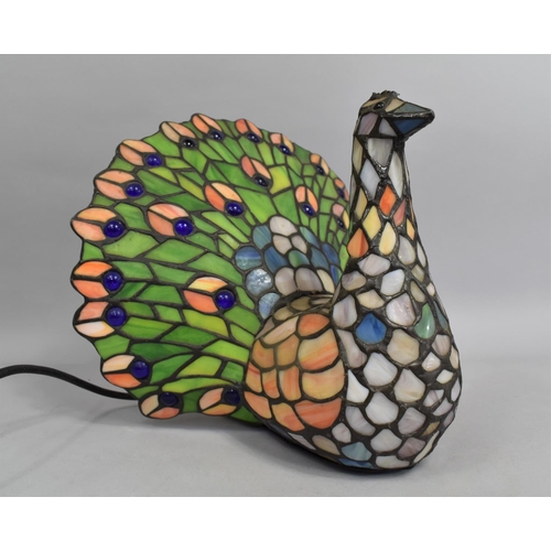 56 - A Reproduction Tiffany Style Novelty Table Lamp in the Form of a Peacock, 28cms High