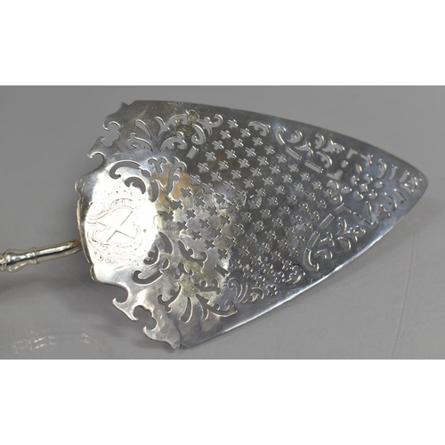 234 - A Georgian Silver Pudding Slice with Pierced Blade, The Tapering Handle culminating From Scrolled Mo... 