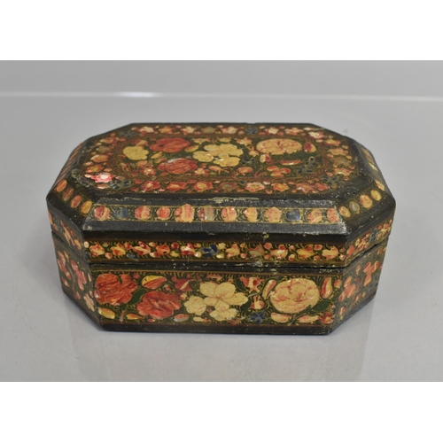 72 - A Kashmiri Box of Rectangular Form with Canted Corners on Black Ground decorated with Polychrome Ena... 