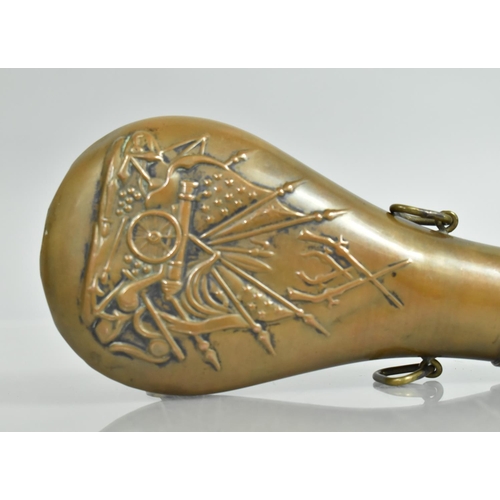 84 - A Copper and Brass Powder Flask with Relief Decoration to Body