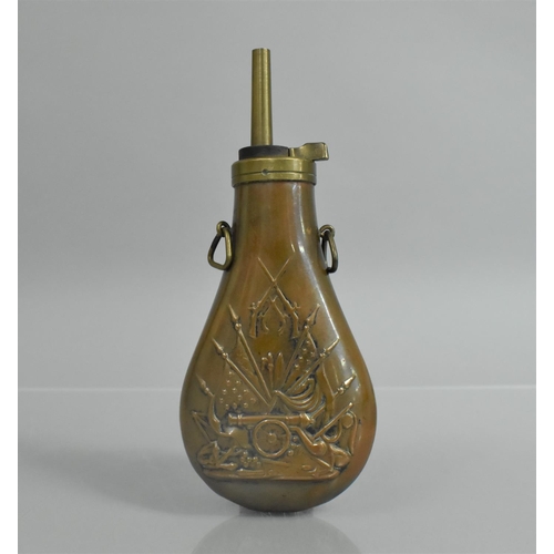 84 - A Copper and Brass Powder Flask with Relief Decoration to Body