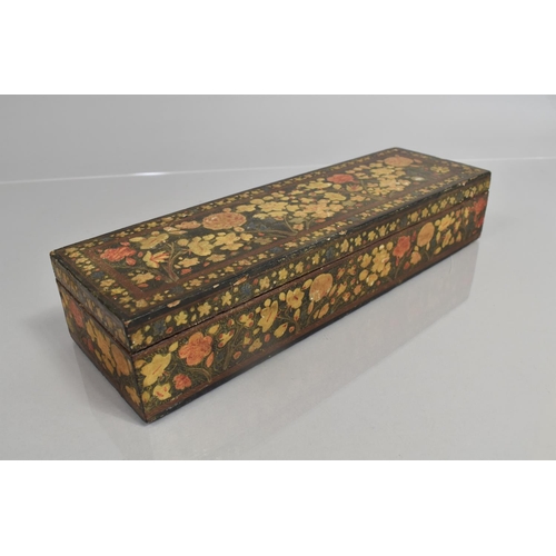 71 - A Kashmiri Box of Rectangular Form decorated with Polychrome Enamels on Black Ground, 33cms Wide