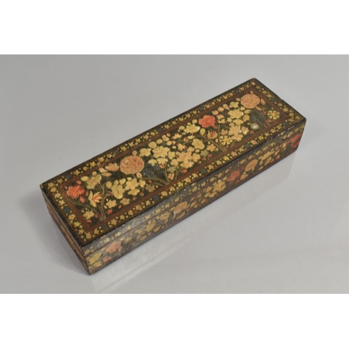 71 - A Kashmiri Box of Rectangular Form decorated with Polychrome Enamels on Black Ground, 33cms Wide