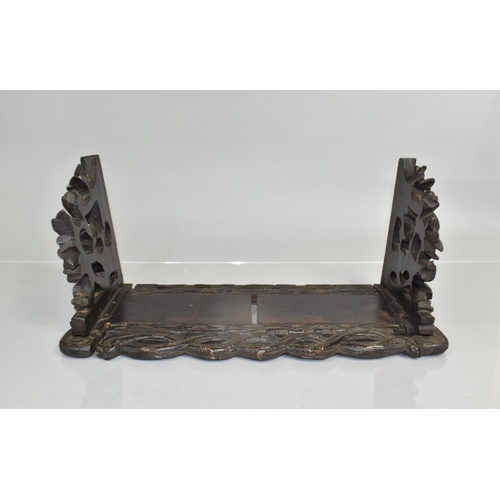 21 - A 19th Century Black Forest Carved Linden Wood Book Slide, 43x20x20cms High