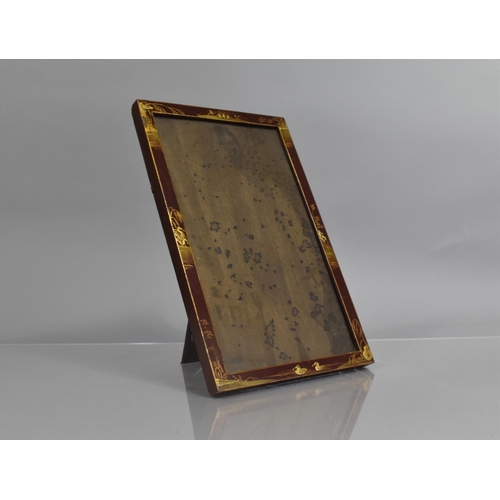 76 - An Early 20th Century Chinoiserie Lacquer Photograph Frame with Gilt Decoration on a Red Ground, 21c... 