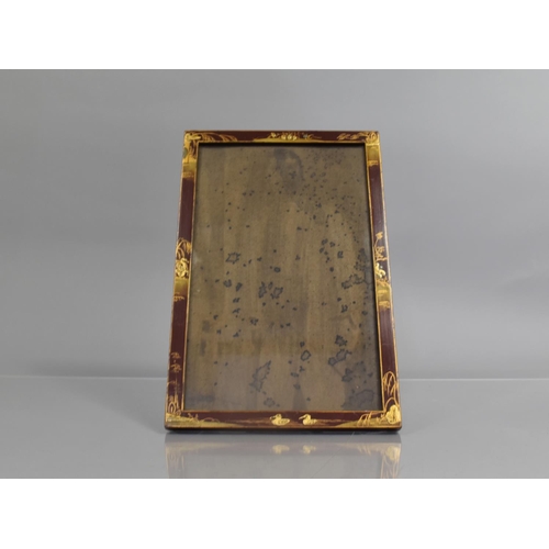 76 - An Early 20th Century Chinoiserie Lacquer Photograph Frame with Gilt Decoration on a Red Ground, 21c... 