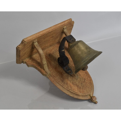 79 - An Early 20th Century Servants Bell Mounted on an Oak Plaque, 32x30cms