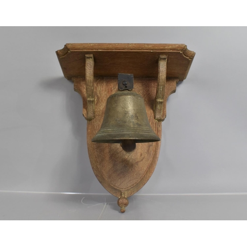 79 - An Early 20th Century Servants Bell Mounted on an Oak Plaque, 32x30cms