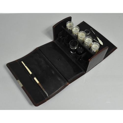 1 - A Late 19th Century Leather Travelling Medicine Case which Opens to Reveal Five Bottles Over Six Sma... 