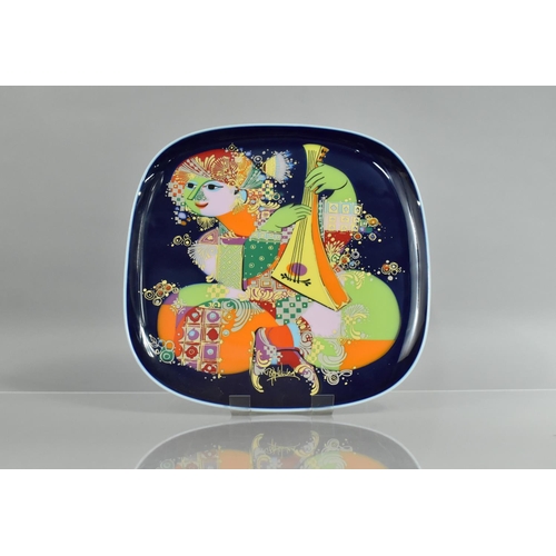 471 - A Bjorn Wimblad Porcelain Square Charger for Rosental Decorated with Brightly Coloured Cross Legged ... 