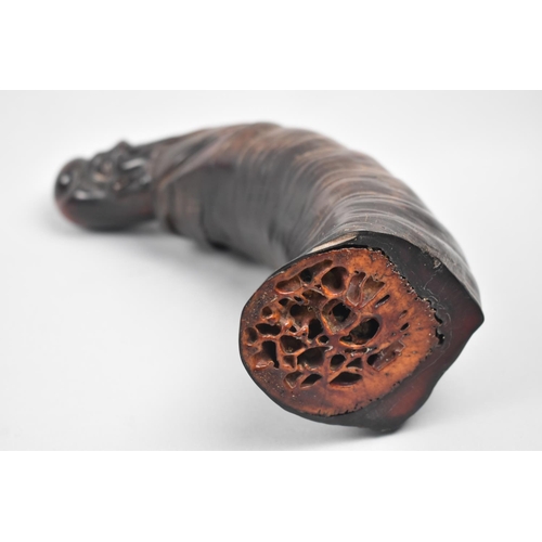 143 - A Chinese Carved Water Buffalo Horn in the Form of a Laughing Elder, 24cms Long