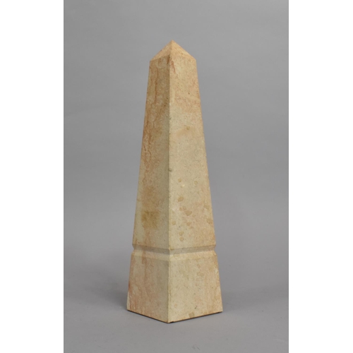 19 - A Modern Reproduction Marble Effect Architectural Needle, 31cms High