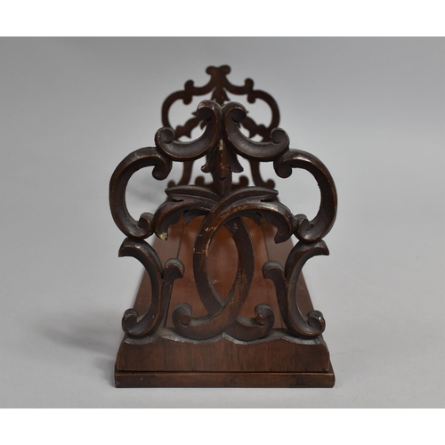 24 - A Late 19th Century Mahogany Book Slide With Carved and Pierced Hinged End Brackets, 33cms Long When... 