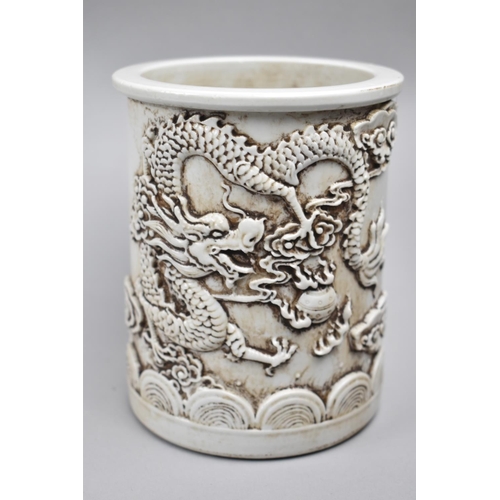 252 - A Reproduction Chinese Blanc De Chine Brush Pot Decorated in Relief with Dragon, Seal Mark to Base, ... 