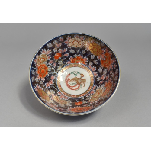 253 - A Japanese Porcelain Imari Bowl, Floral Motif Decoration and Central Phoenix Cartouche, Blue Charact... 