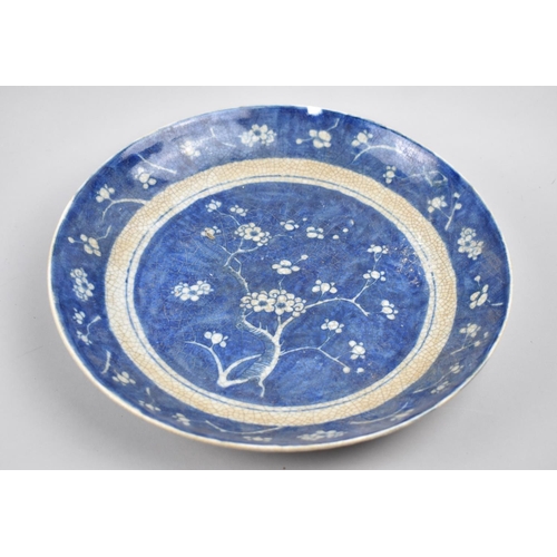 260 - A Repoduction Chinese Blue and White Crackle Glazed Charger, Prunus Pattern, 28cm diameter