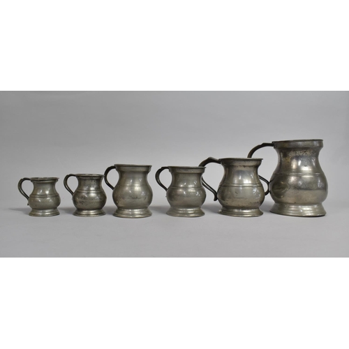 27 - A Collection of Six Graduated Pewter Measures Dating from Victoria to Elizabeth II, tallest 14cms Hi... 