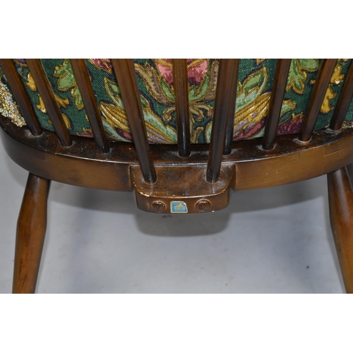 542 - An Ercol Spindle Back Armchair