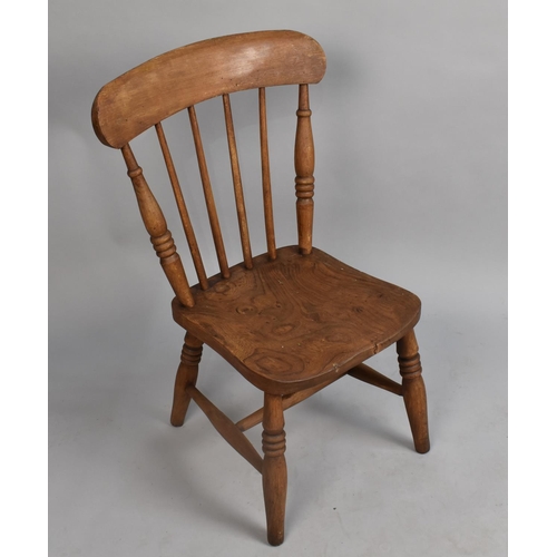 555 - A Vintage Elm Seated Spindleback Childs Chair