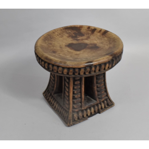 56 - An Early 20th Century African Headrest or Stool with Circular Top, 25cms Diameter and 23cms High