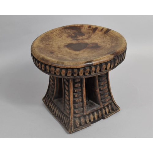 56 - An Early 20th Century African Headrest or Stool with Circular Top, 25cms Diameter and 23cms High