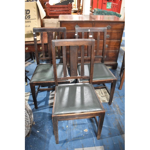 562 - A Set of Three 19th Century Oak Dining Chairs with Leather Pad Feet