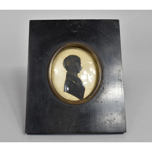 8 - A 19th century Silhouette of a Young Man, Ebonised Frame, 16x12cms