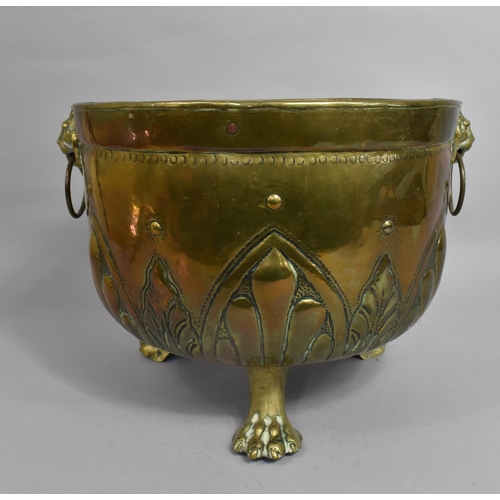 83 - An Edwardian Circular Brass Coal Bucket on Three Claw Feet, Lion Mask Ring Handles, 32cms Diameter