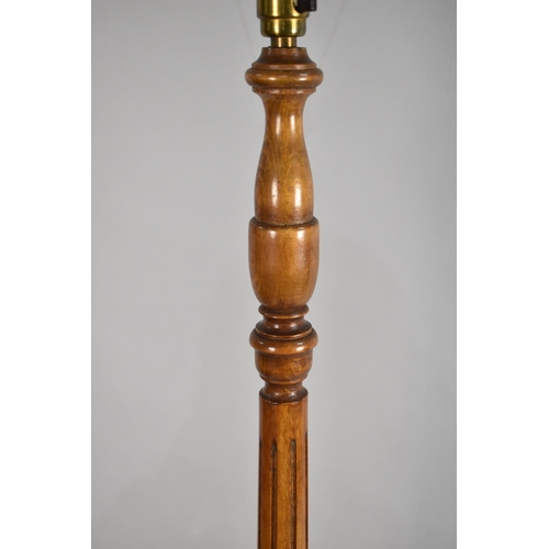 92 - A Mid 20th century Standard Lamp with Reeded Carved Support, Circular Base