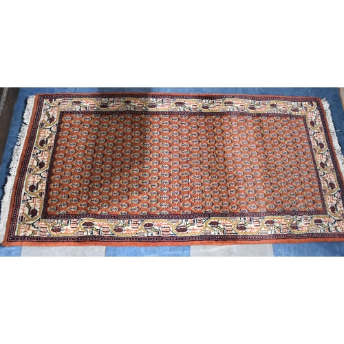 521 - A Hand Made Sarough Rug, 133x70cms