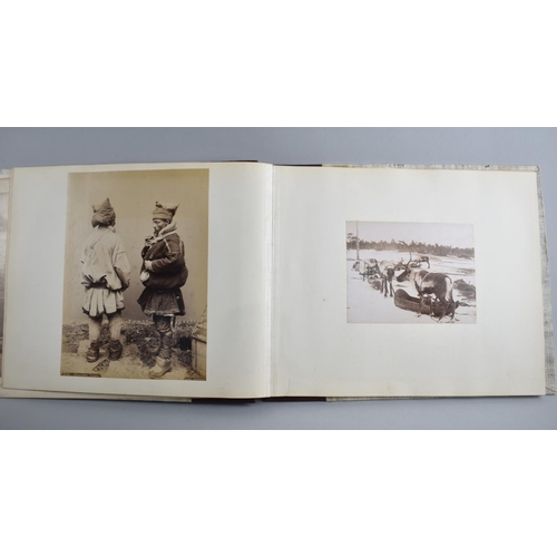 59 - A Late 19th century Photo Album Containing Monochrome and Hand Coloured Photographs of People and Pl... 