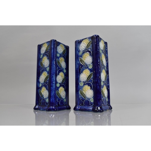 100 - A Pair of Square Form Vases decorated with Floral Tube line Design on Blue Ground, 21cms High, Impre... 