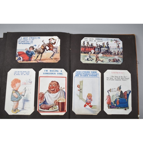 102 - A Vintage Postcard Album Containing Early 20th Century Humorous Postcards