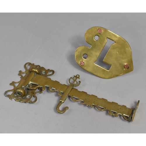 112 - A Victorian Brass Range Crane and a Heart Shaped Trivet Monogrammed L