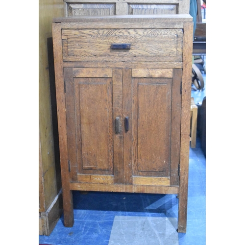 466 - An Edwardian Oak Side Cabinet with Top Drawer and Panelled Cupboard Doors, 55cm wide