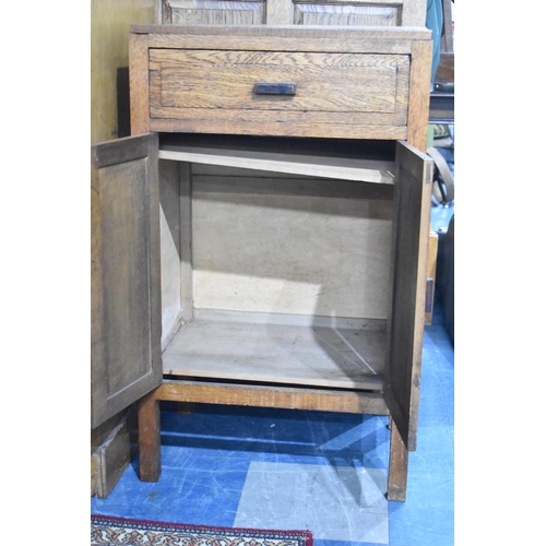 466 - An Edwardian Oak Side Cabinet with Top Drawer and Panelled Cupboard Doors, 55cm wide