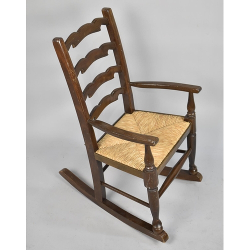 469 - A Mid 20th Century Child's Back Ladder Back Rocking Chair