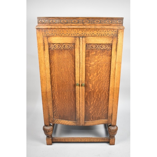 482 - An Edwardian Oak Fitted Cabinet with Hinged Top to Storage Area, Panelled Doors to base Cupboard, 67... 