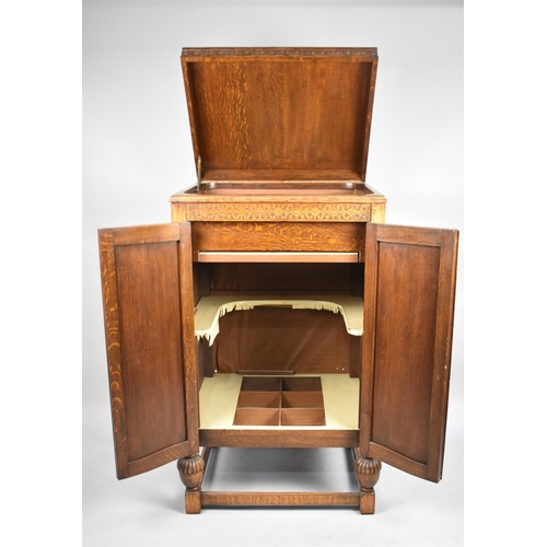 482 - An Edwardian Oak Fitted Cabinet with Hinged Top to Storage Area, Panelled Doors to base Cupboard, 67... 