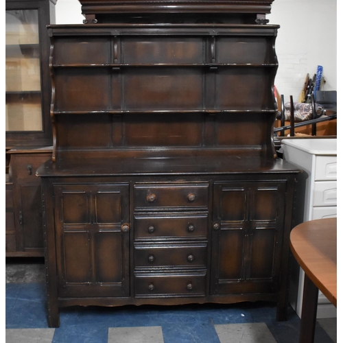 486 - An Ercol Dresser the Base with Four Centre Drawers Flanked by Cupboards, Raised Two Shelf Plate Rack... 