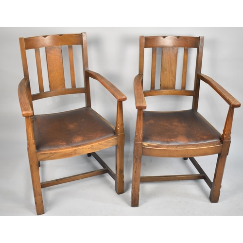 512 - A Pair of Edwardian oak Framed Armchairs