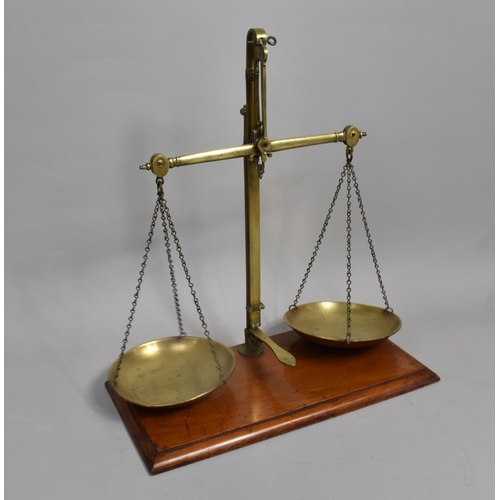 69 - A Set of Late 19th century Brass Pan Scales on Mahogany Wooden Plinth by J Hare, 46cms Wide and 51cm... 