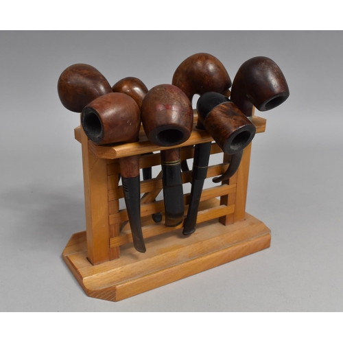 214 - A Mid 20th Century Novelty Pipe Stand in the Form of a Five Bar Gate Together with Seven Vintage Bri... 