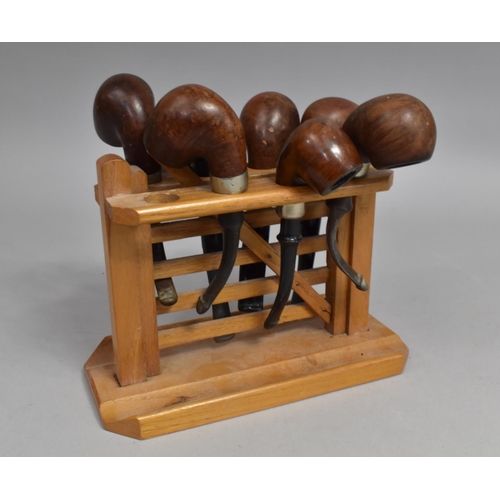 214 - A Mid 20th Century Novelty Pipe Stand in the Form of a Five Bar Gate Together with Seven Vintage Bri... 