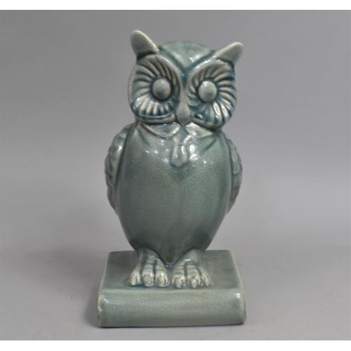 397 - A Glazed Study of Owl on Book, 14cms High