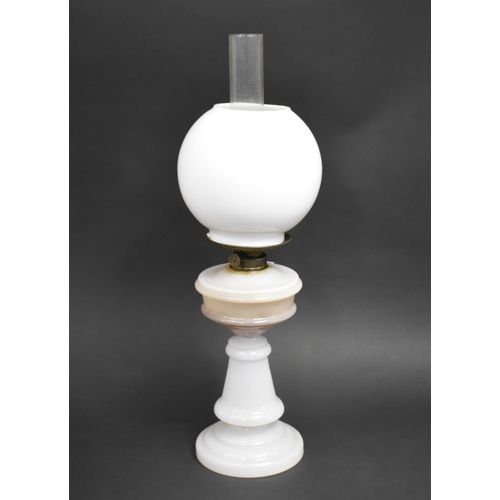 408 - An Opaque Glass Based Oil Lamp with Globular Shade, 58cms High