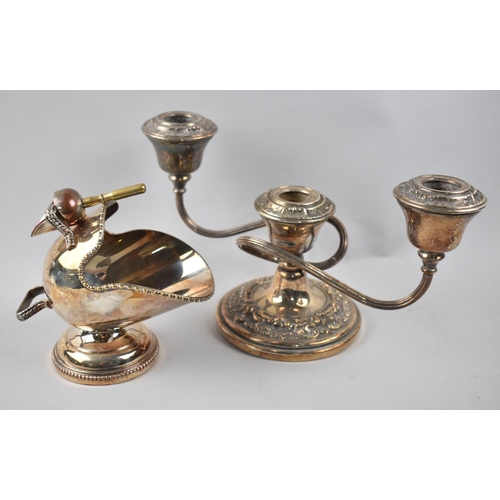 63 - A Squat Three Branch Candelabra together with a Silver Plated Helmet Shaped Sugar Bowl with Scoop